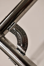 Close-up of the signature Abstracta metal connector joint mechanism and branding