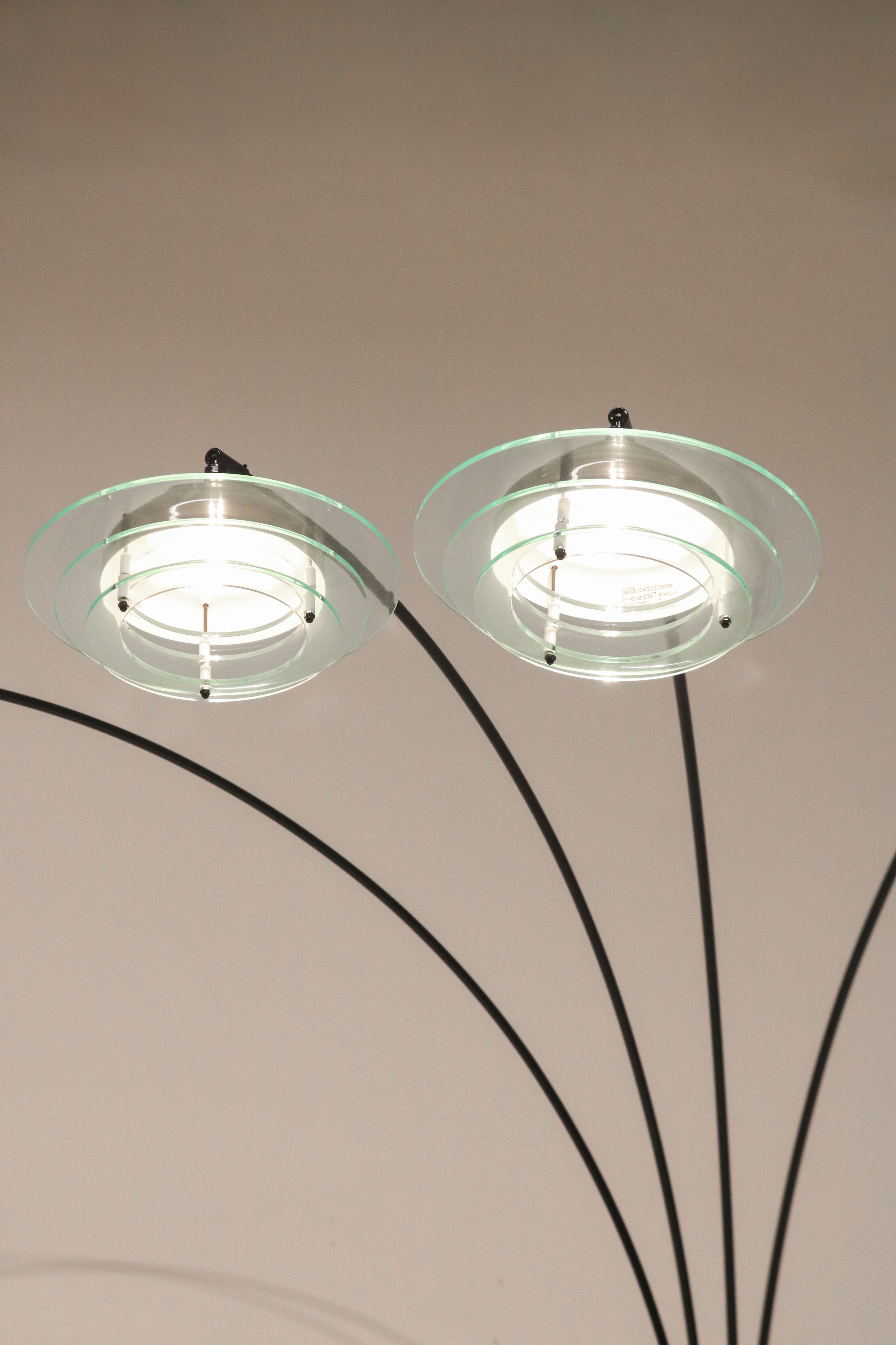 Close-up of lit acrylic shade with stacked saucer UFO design