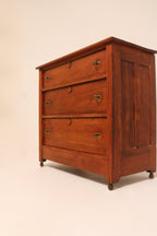 Angled front view highlighting the warm antique wood patina and finish