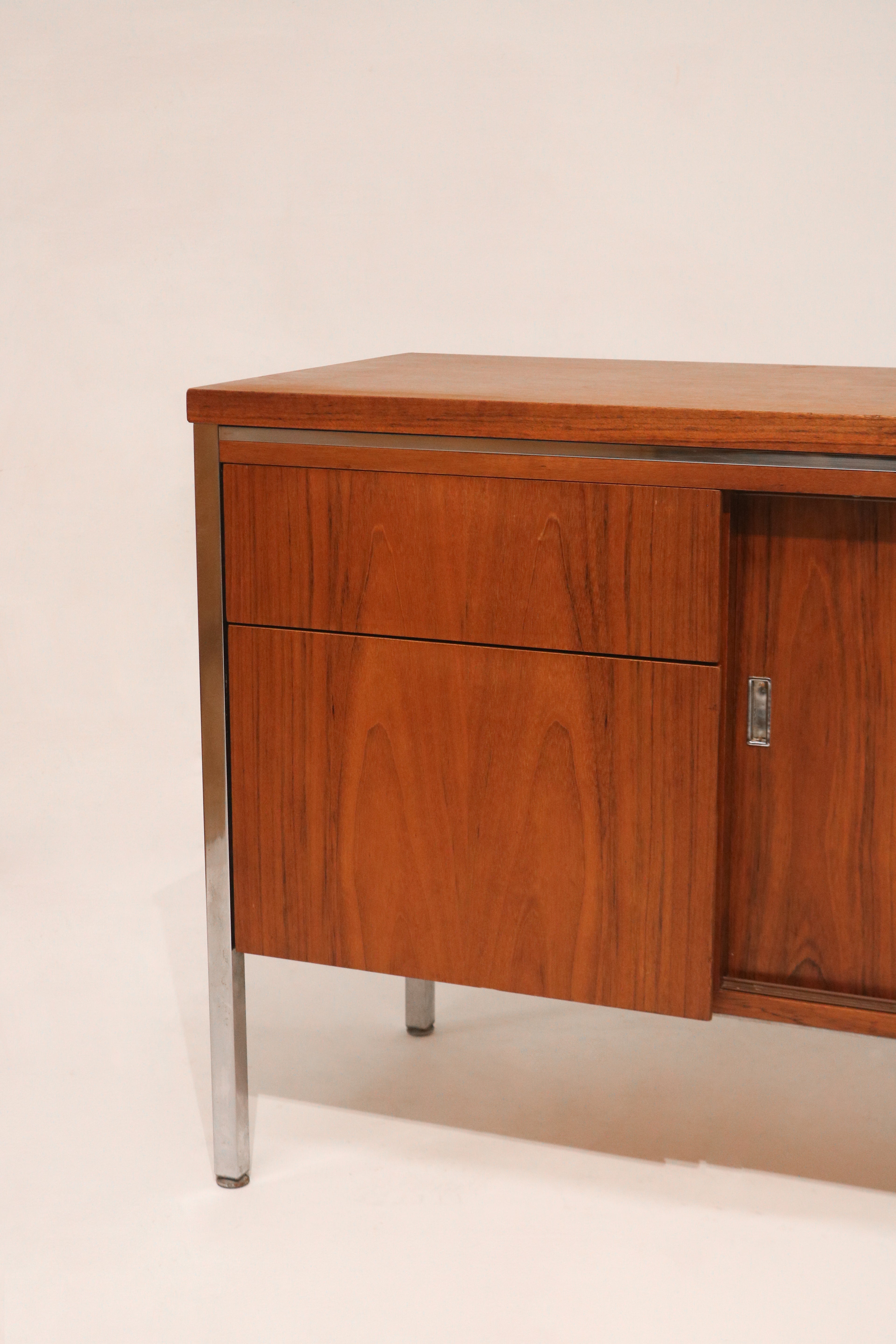 Angled left view emphasizing the chrome frame and walnut contrast