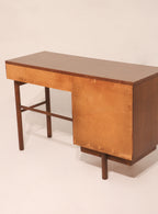 Angled rear view showing desk suitability for open room placement
