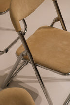Angled view of seat showing chrome support structure underneath