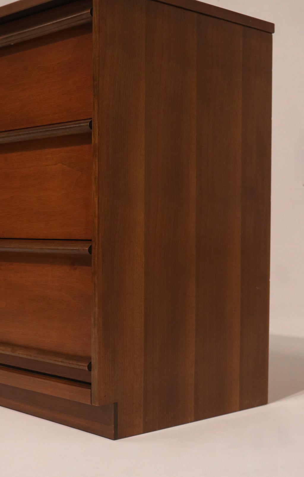 Close-up of the top corner showing walnut finish and condition