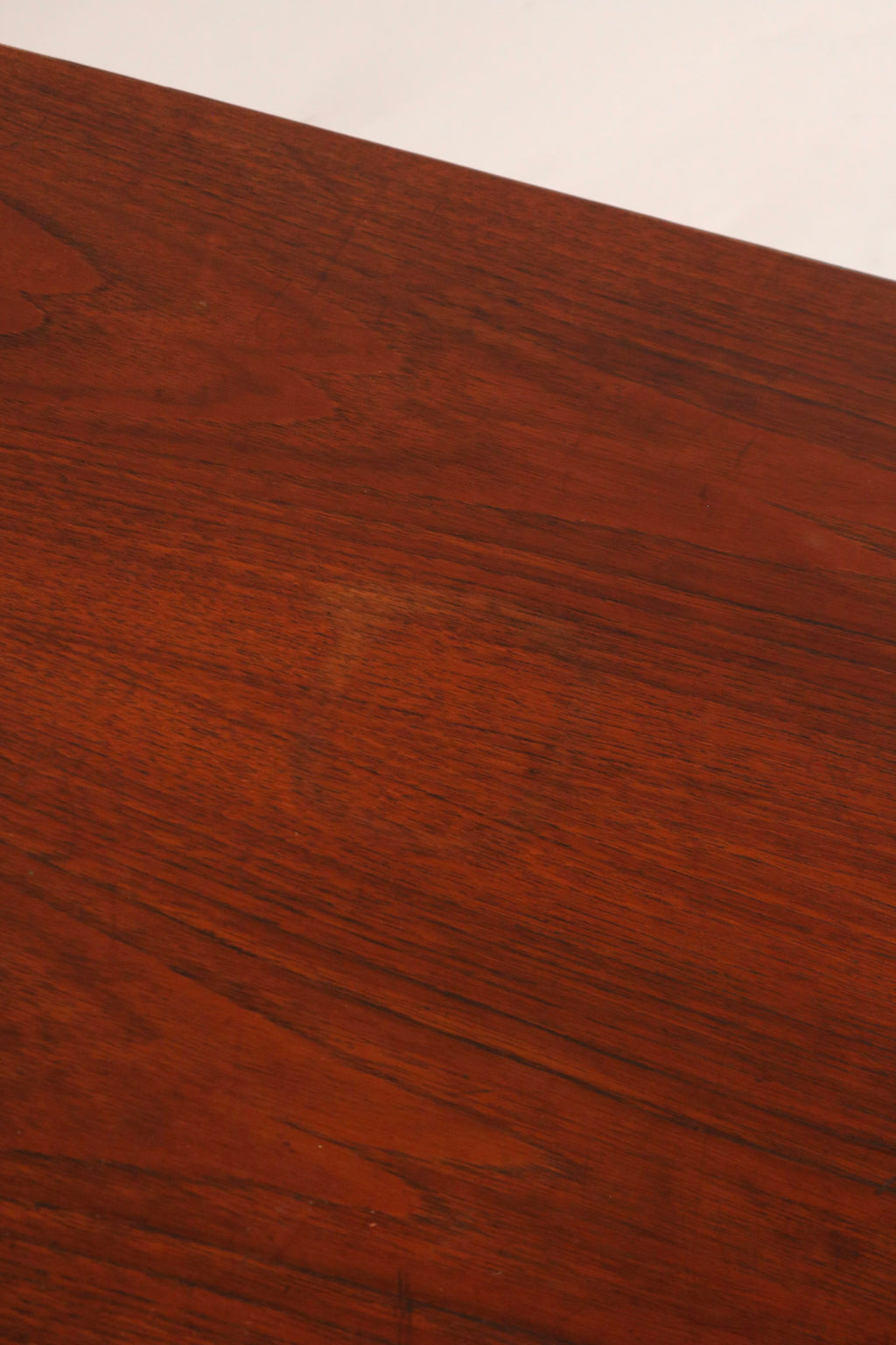 High angle view showing walnut top and industrial steel cabinet design