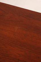 High angle view showing walnut top and industrial steel cabinet design