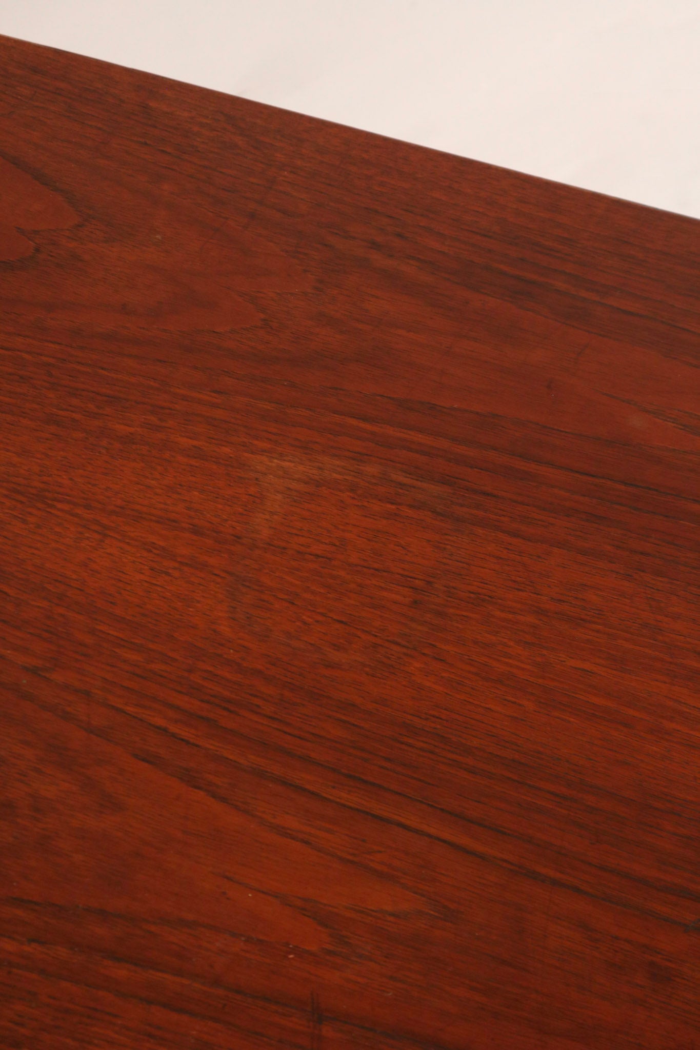 High angle view showing walnut top and industrial steel cabinet design