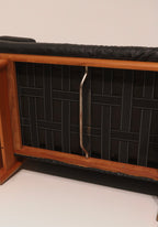 Angled top view showing loveseat cushions and teak frame visibility