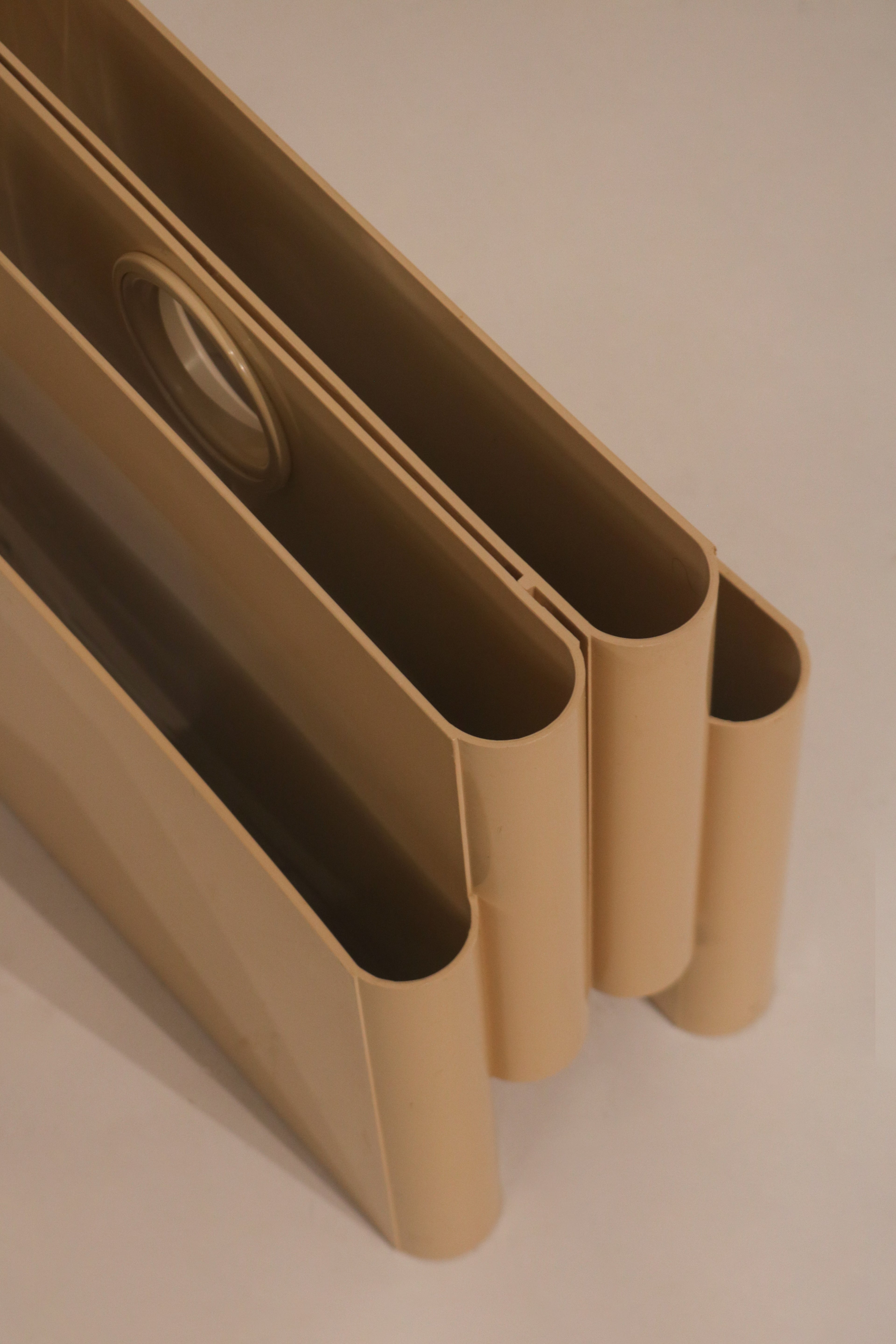 Angled top view showing the vintage yellowing patina on the original white plastic