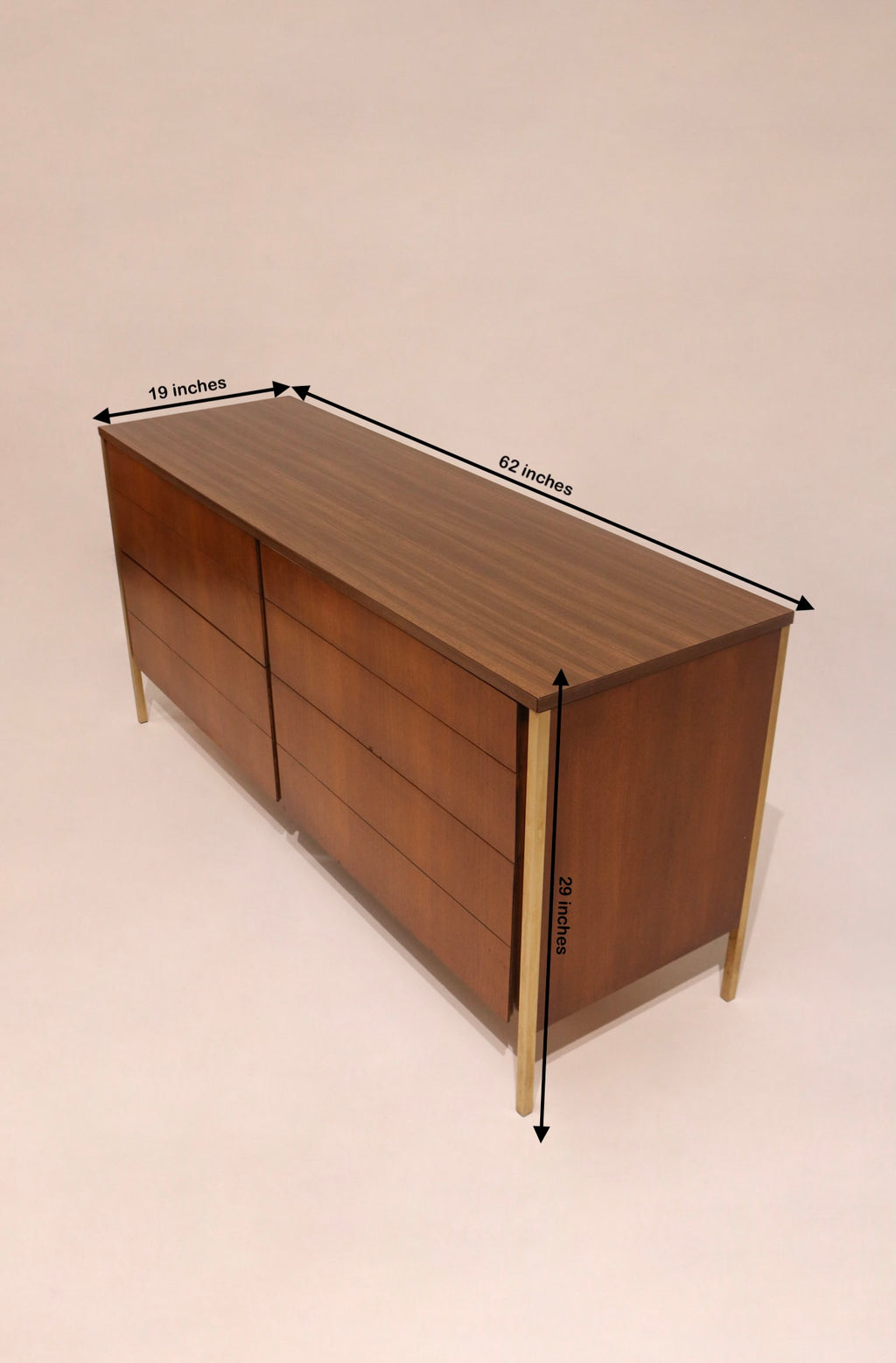 Angled top view showing walnut credenza design with gold metal accents