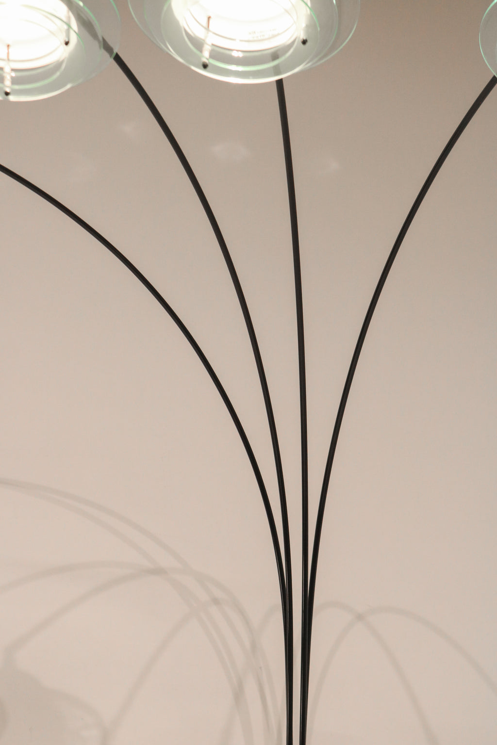 View of the four arching metal arms creating a fountain or spider effect