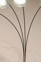 View of the four arching metal arms creating a fountain or spider effect