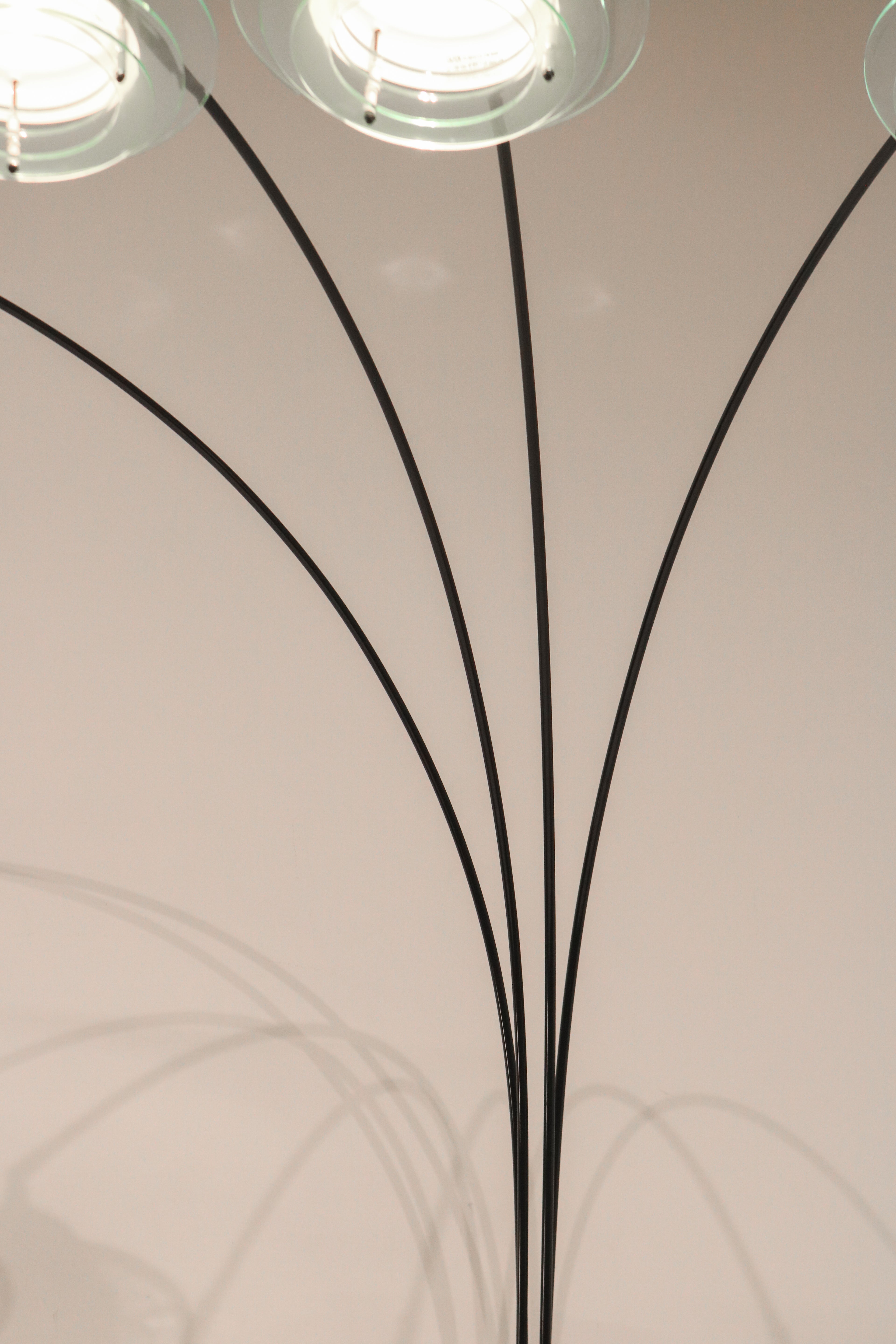 View of the four arching metal arms creating a fountain or spider effect