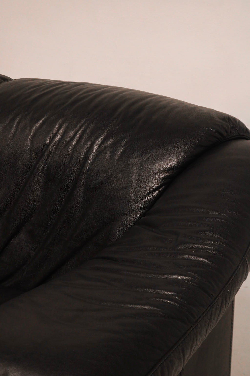 Back angle view showing overall shape and tight fitting upholstery design