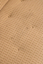 Detail of backrest button tufting demonstrating vintage upholstery style