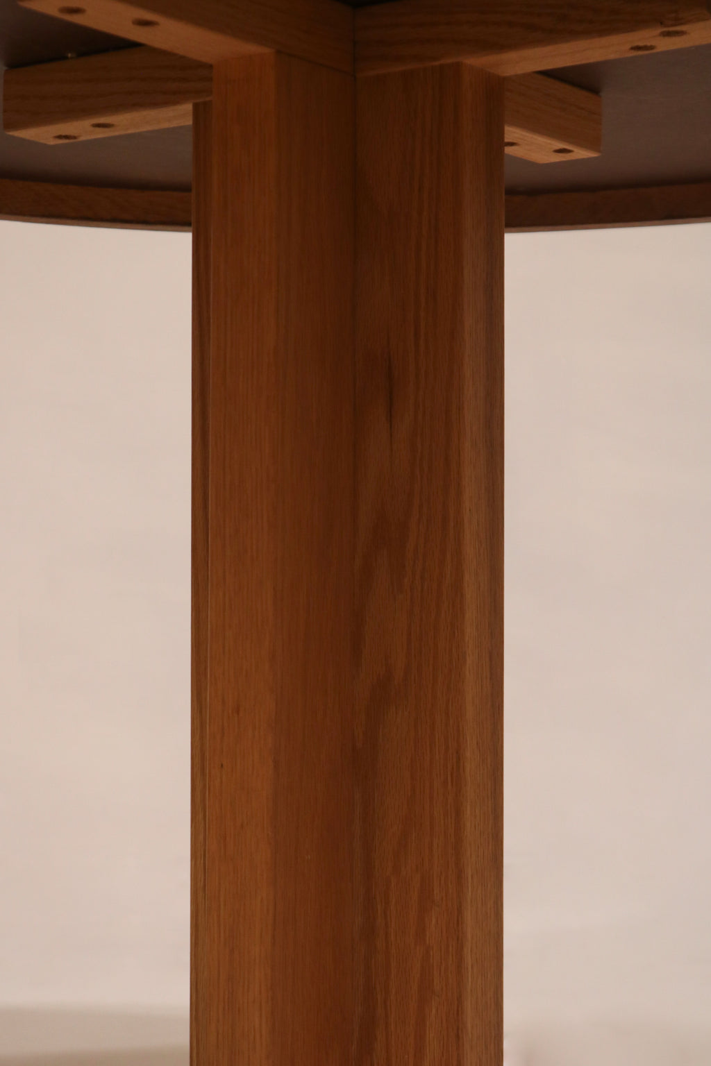 Base center joint detail showing oak cross structure and assembly quality