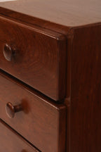 Detail of the base plinth design supporting the heavy solid wood structure