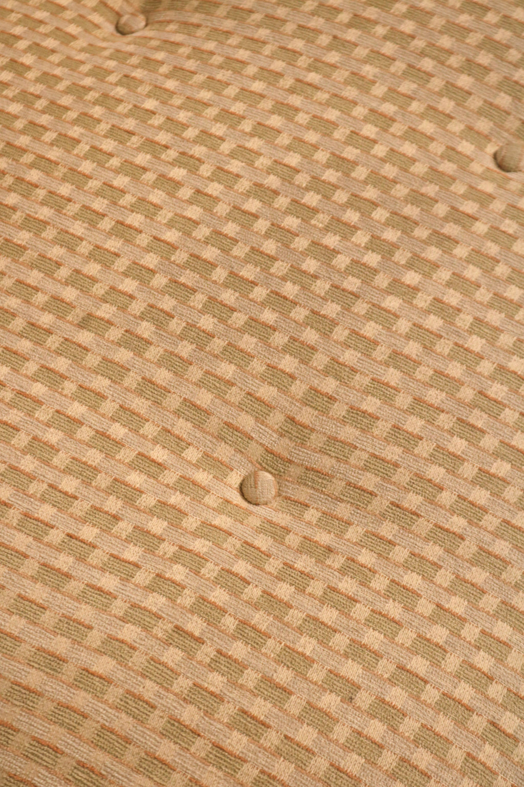 Extreme close-up of beige fabric weave pattern and texture quality