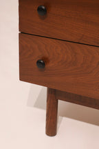 Close-up of the original black metal knob pulls characteristic of Stanley