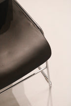 Close-up detail of black seat edge finish and condition showing light wear