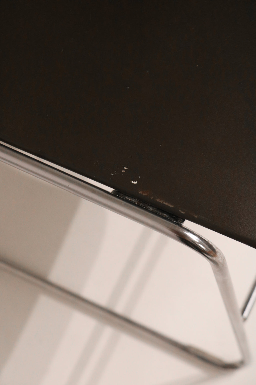 Close-up of black seat surface texture and material condition