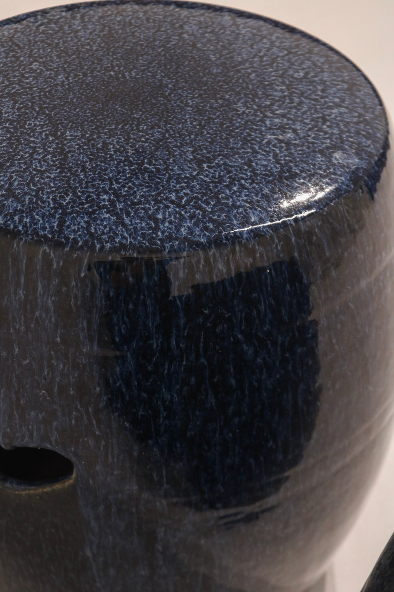 Single vintage blue ceramic garden stool showing decorative pattern and finish