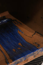 Close-up of the bottom edge showing glaze finish and condition