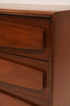 Detail of bottom left drawers highlighting the sculpted design element