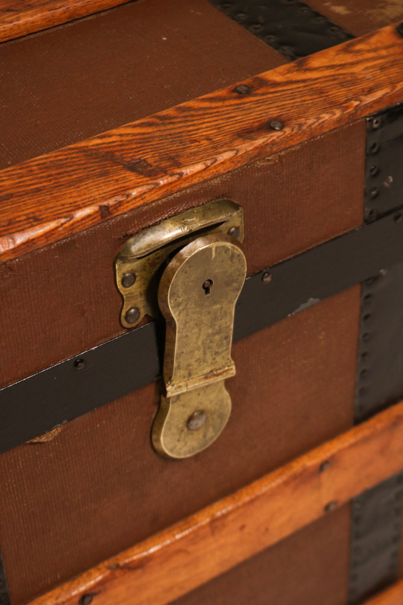 Close-up of central brass latch lock mechanism and patina