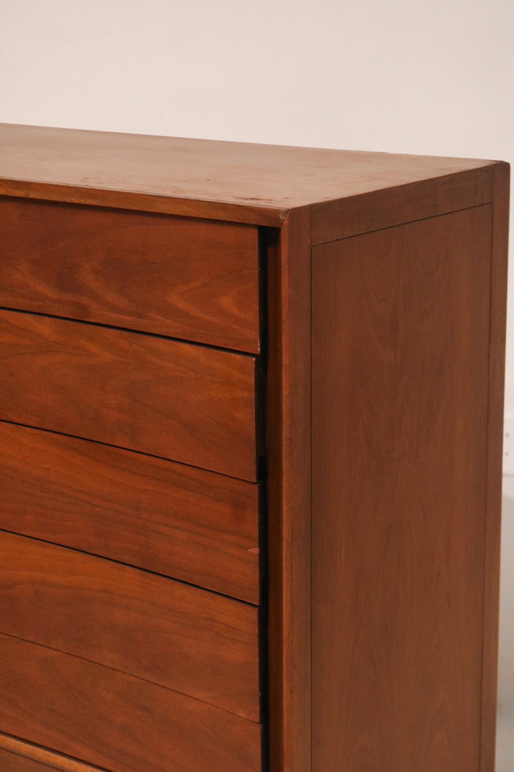 View of the cabinet door open revealing interior shelves or drawers