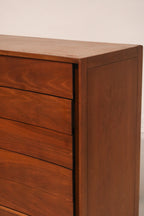 View of the cabinet door open revealing interior shelves or drawers