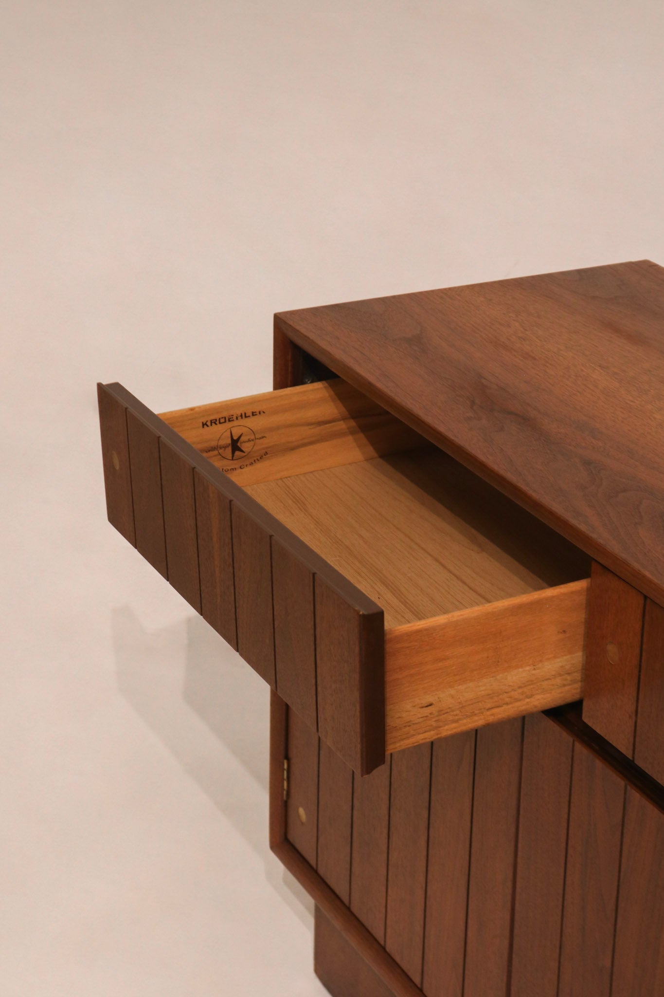 Cabinet doors open revealing full interior storage layout