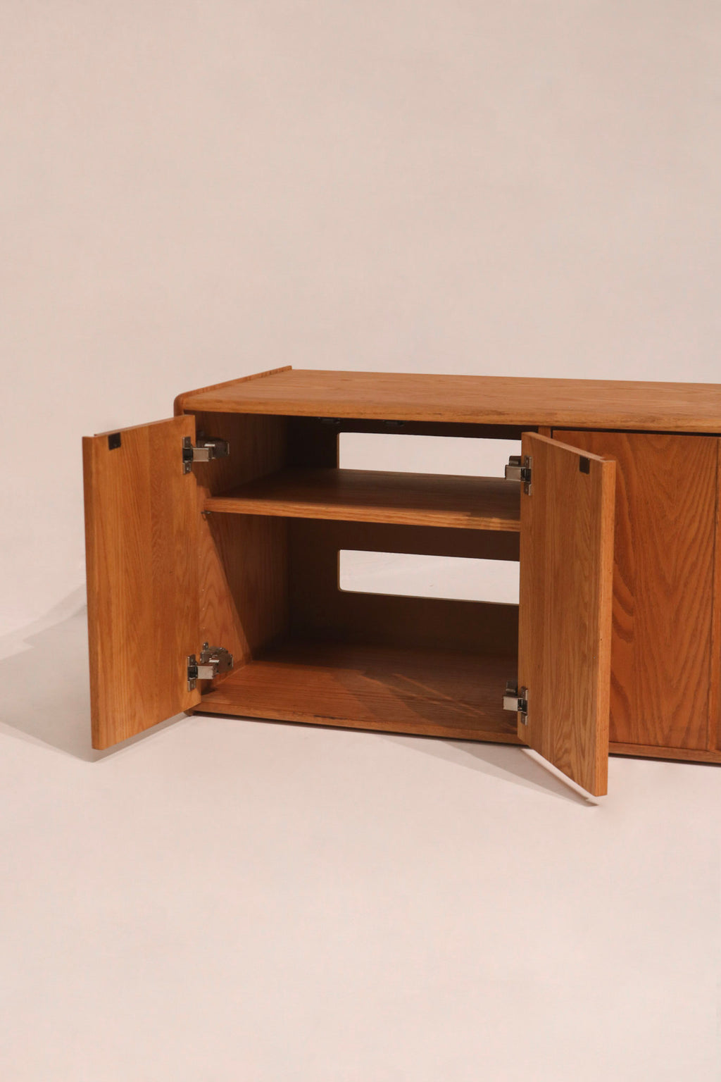 Front view with doors open showing interior storage compartment