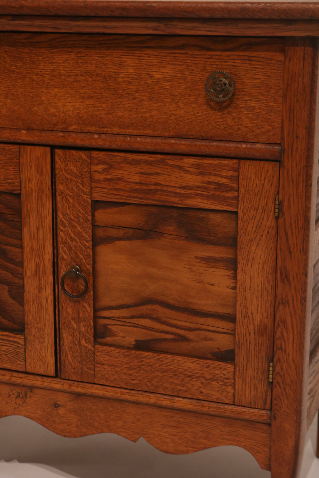 View of cabinet interior with door open showing storage space