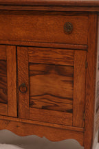 View of cabinet interior with door open showing storage space