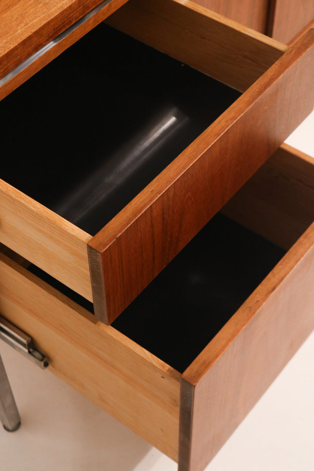 Interior view of the cabinet side showing shelf and storage space