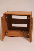 Interior view of cabinet nightstand showing shelf and storage space