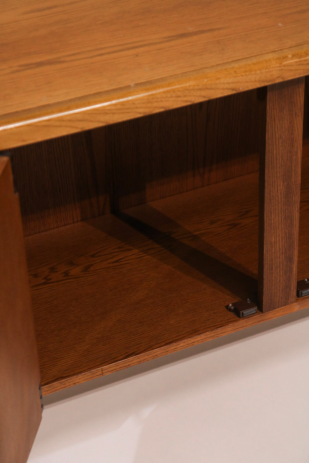 Interior view of the cabinet showing storage shelf and space