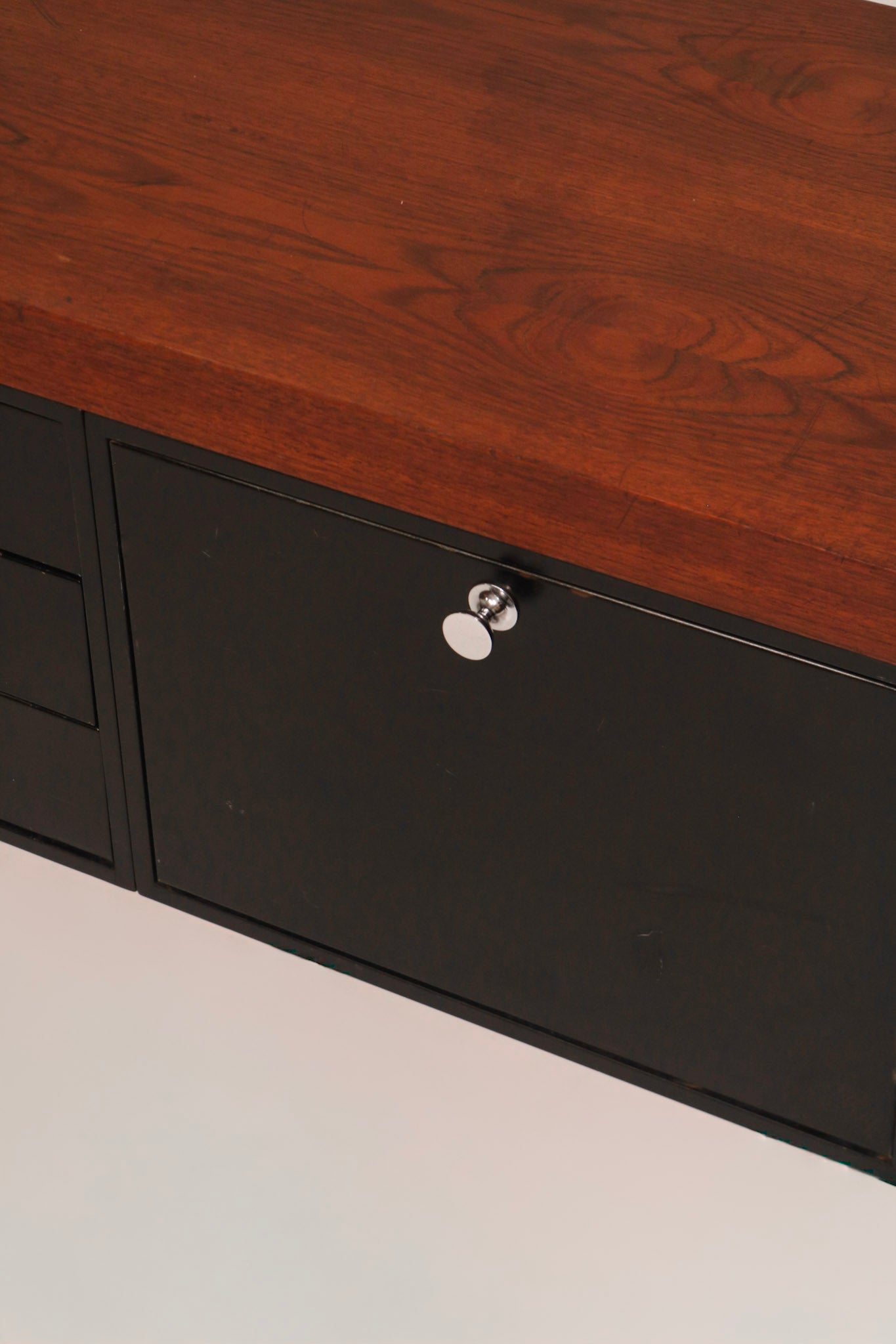 Close-up of chrome cabinet lock mechanism (key status check description)