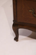 Detail of carved cabriole leg and foot design characteristic of French style