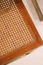 Close-up showing small hole damage on one chair seat cane weave