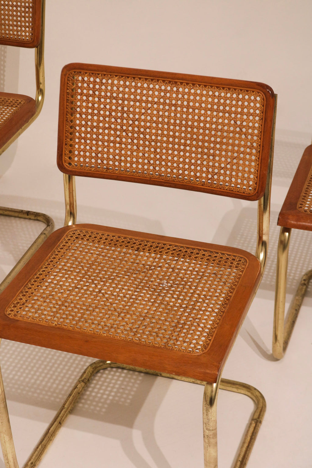 Close-up view of cane seat weave pattern and wood frame