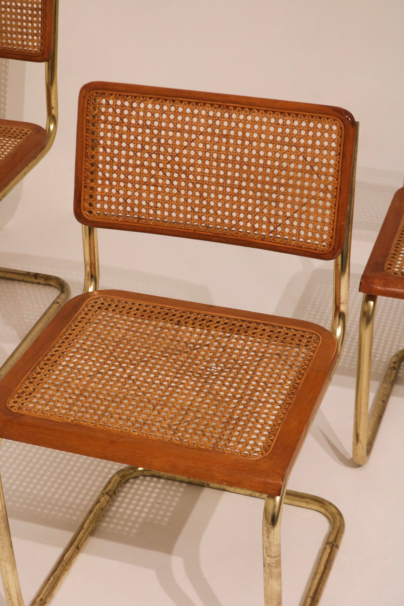 Close-up view of cane seat weave pattern and wood frame
