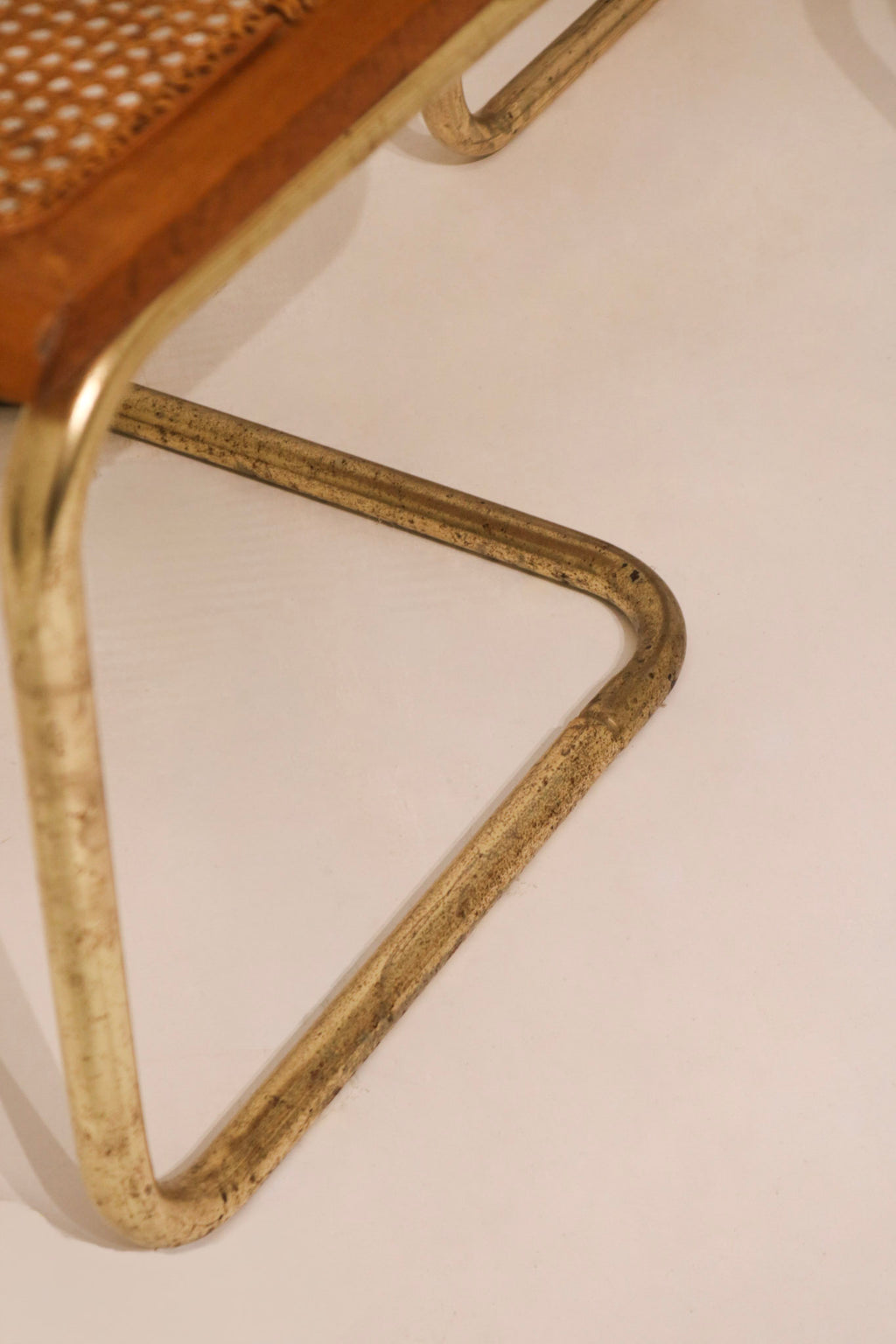 Detail of cantilever tubular metal frame chair base design