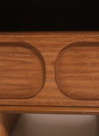 Detail of carved geometric design on the drawer front