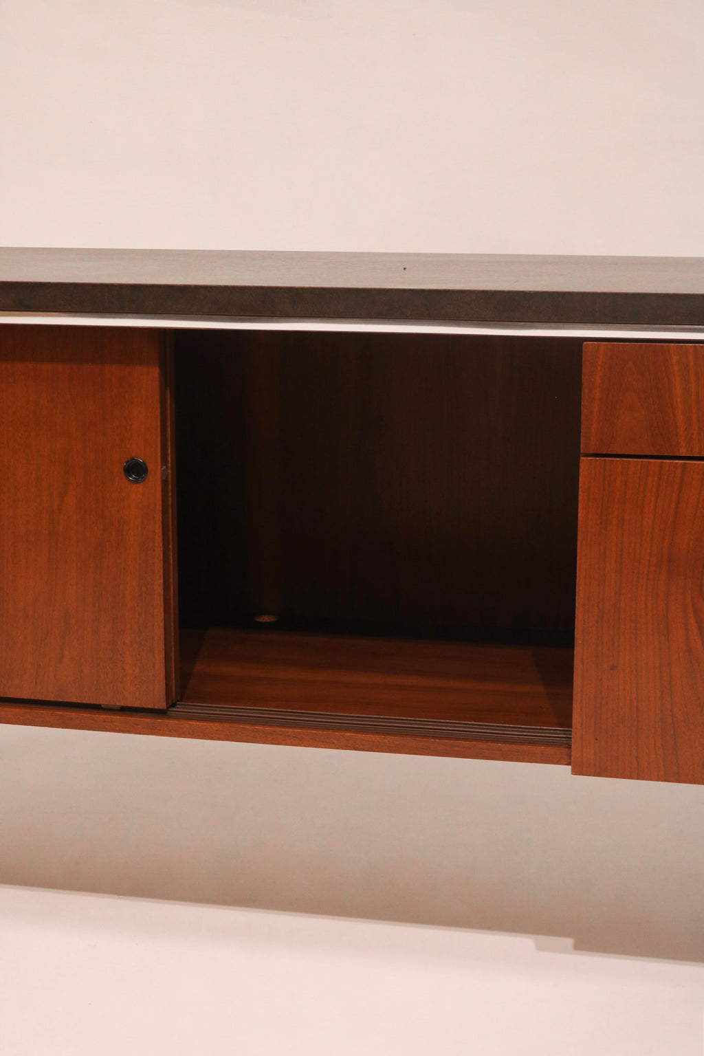 View of the center cabinet interior shelf space for storage