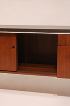 View of the center cabinet interior shelf space for storage