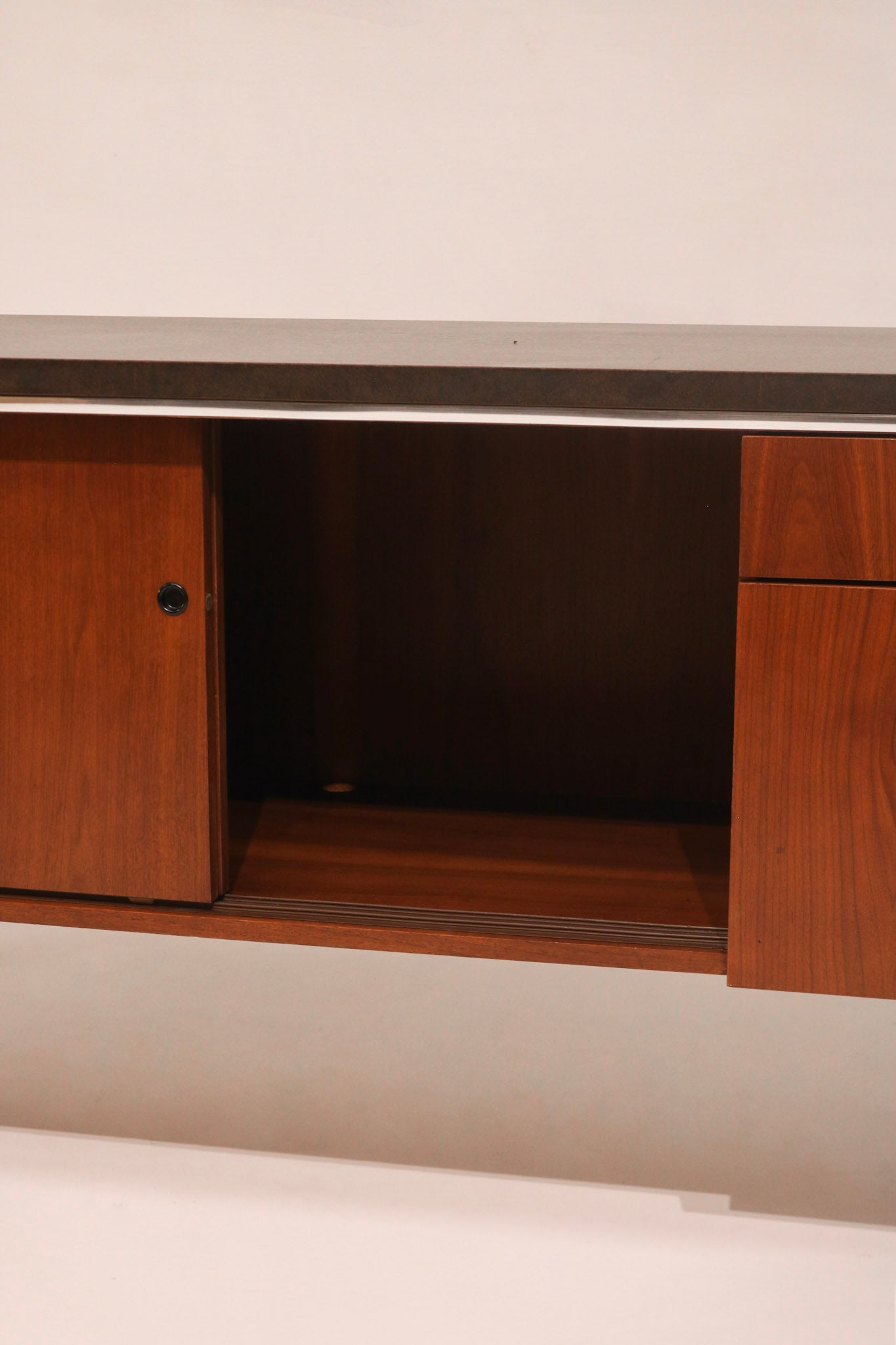 View of the center cabinet interior shelf space for storage
