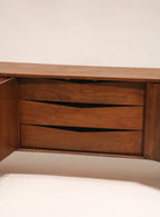 Detail of the center bank of drawers emphasizing the facade curve