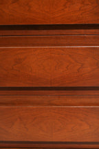 Close-up of center drawer fronts showing matched wood grain pattern