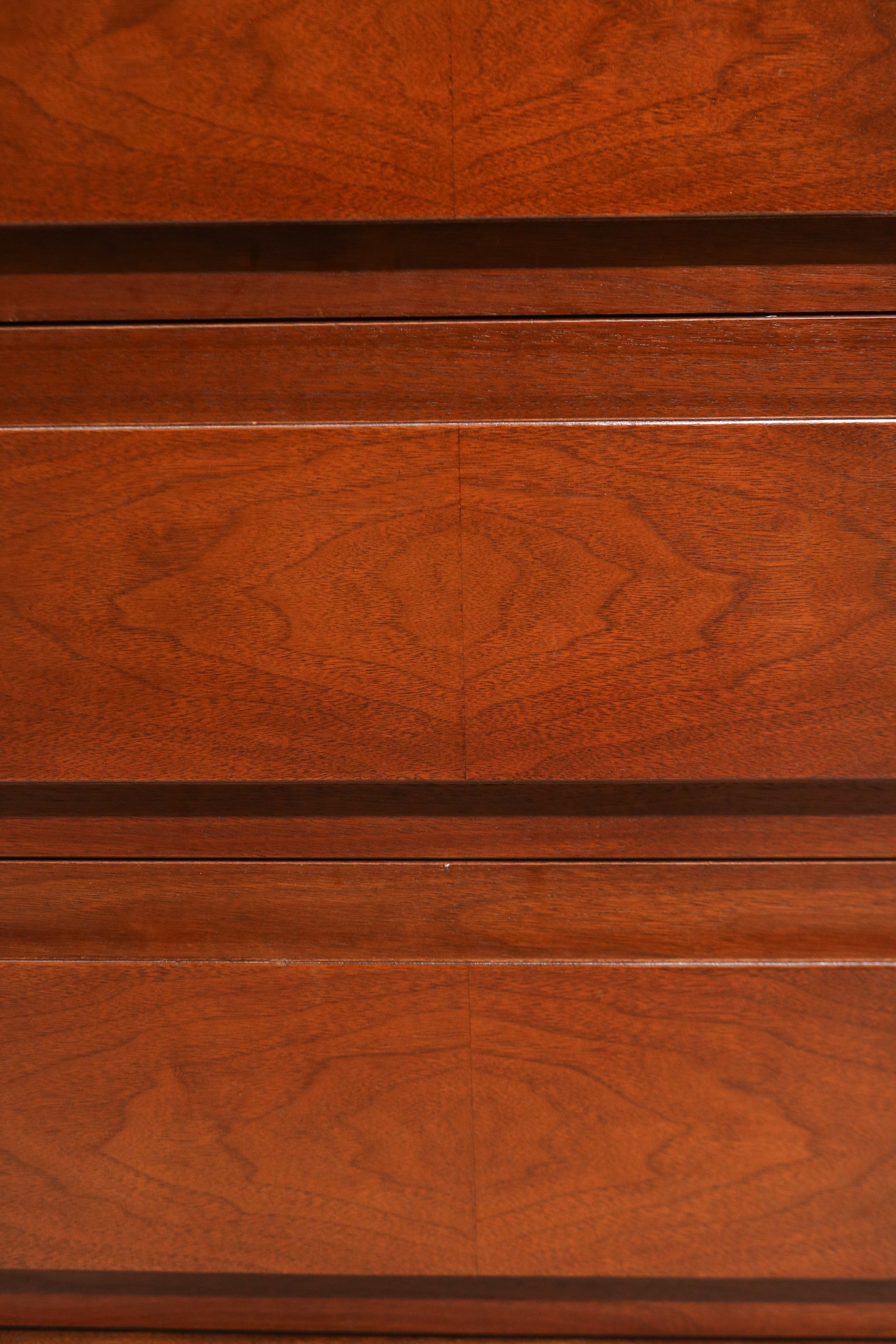 Close-up of center drawer fronts showing matched wood grain pattern